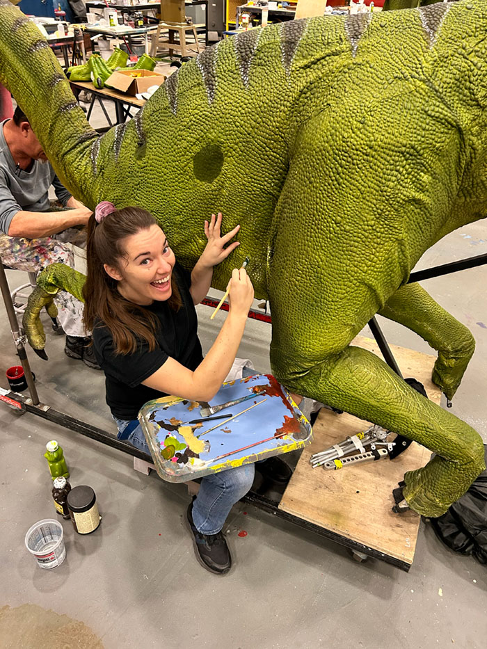 Anna C. Baldwin-Lack working on a dinosaur prop